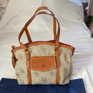 Previously owned Dooney and Bourke shoulder bag with tassels no dust bag